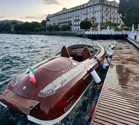 Luxury private boat tour on Lake Como passing historic lakeside villas